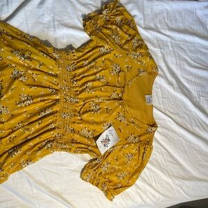 SirenLily yellow, floral dress. Tie at bust, modest puff sleeves, bottom ruffle.